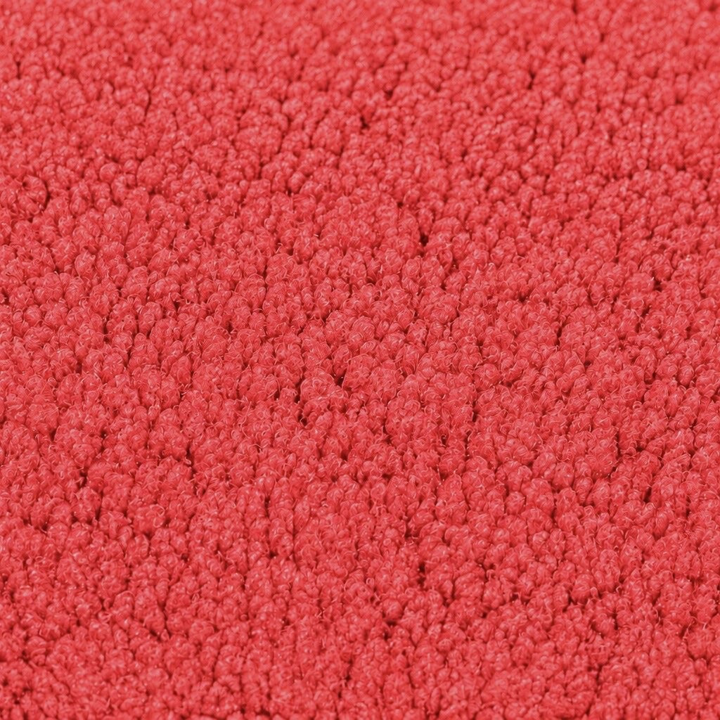 Gros plan de la maille bouclette Orbe Paris, coloris Rouge corail