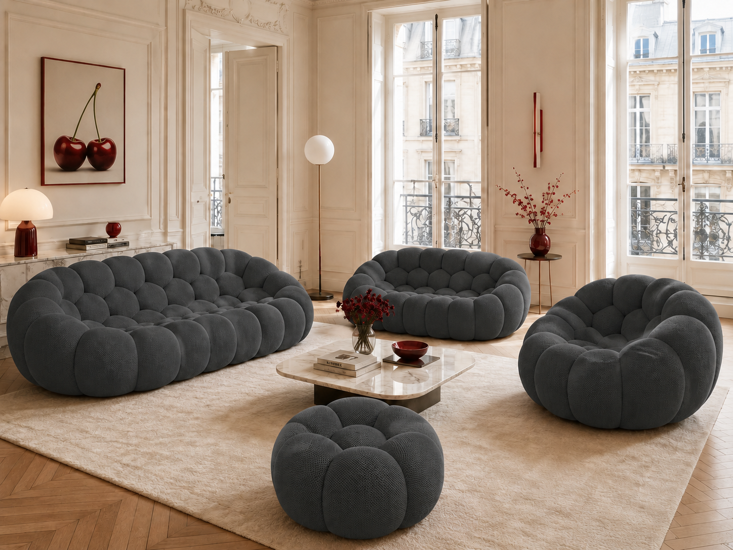 Canapé Rousseau, fauteuil et pouf Gris anthracite dans un salon parisien lumineux — Orbe Paris