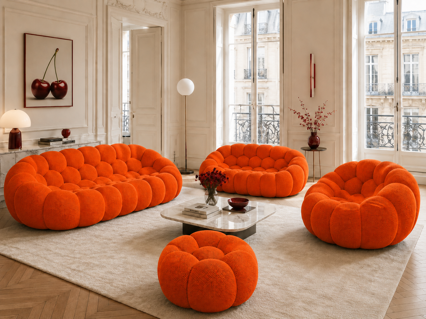 Canapé Rousseau, fauteuil et pouf Orange vif dans un salon parisien lumineux — Orbe Paris