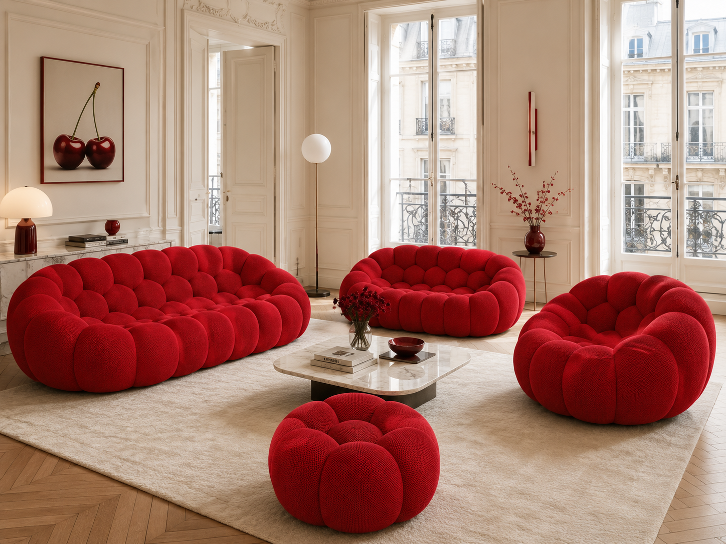 Canapé Rousseau, fauteuil et pouf Rouge profond dans un salon parisien lumineux — Orbe Paris