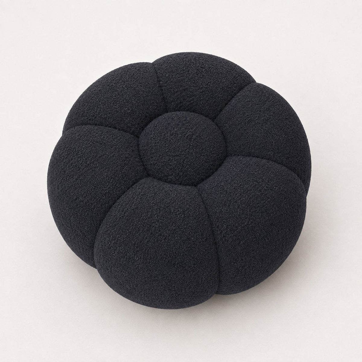 Pouf Rousseau en maille bouclette Noir, vu de face sur fond studio — Orbe Paris