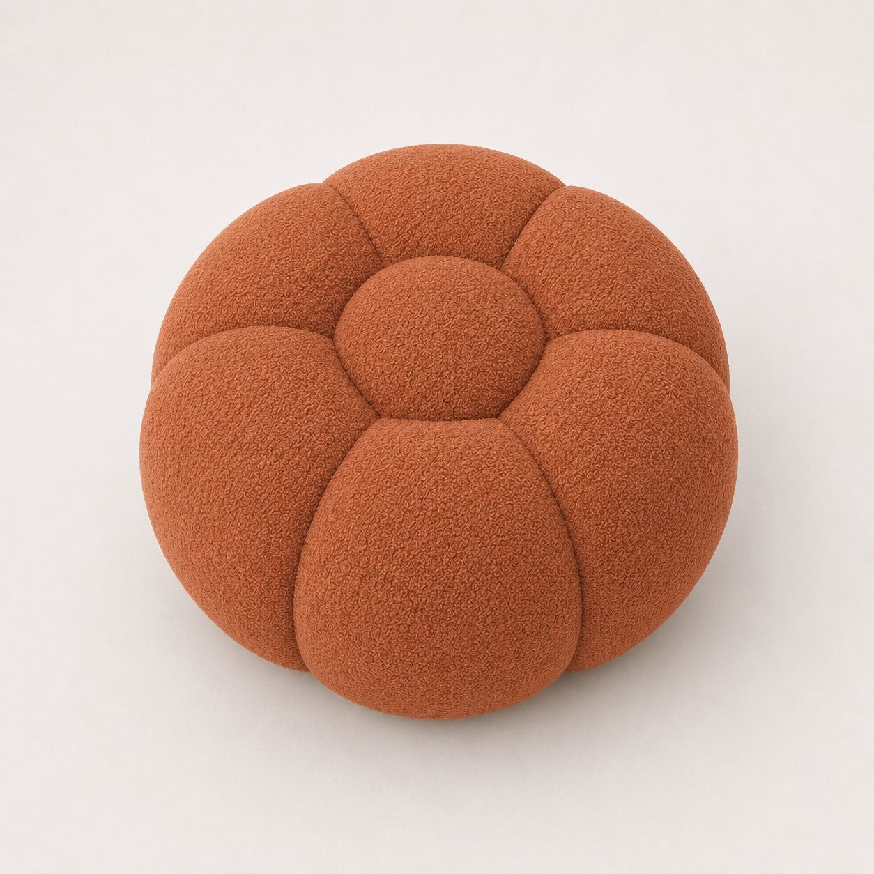 Pouf Rousseau en maille bouclette Terracotta, vu de face sur fond studio — Orbe Paris