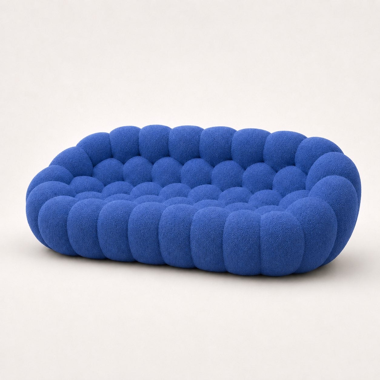 Canapé Rousseau 3-4 places en maille bouclette Bleu roi, vu de profil sur fond studio — Orbe Paris