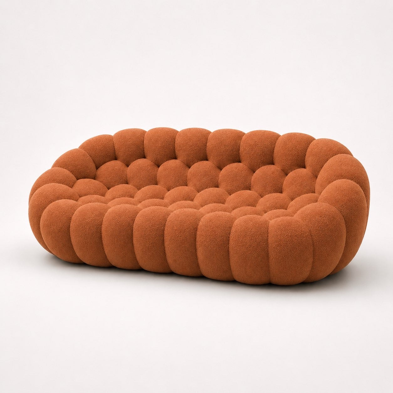 Canapé Rousseau 3-4 places en maille bouclette Terracotta, vu de profil sur fond studio — Orbe Paris