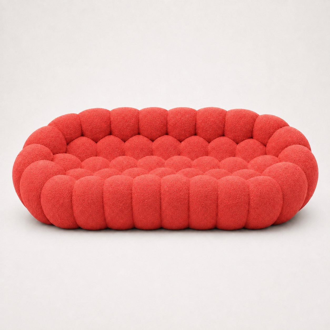 Canapé Rousseau 3-4 places en maille bouclette Rouge corail, vu de face sur fond studio — Orbe Paris