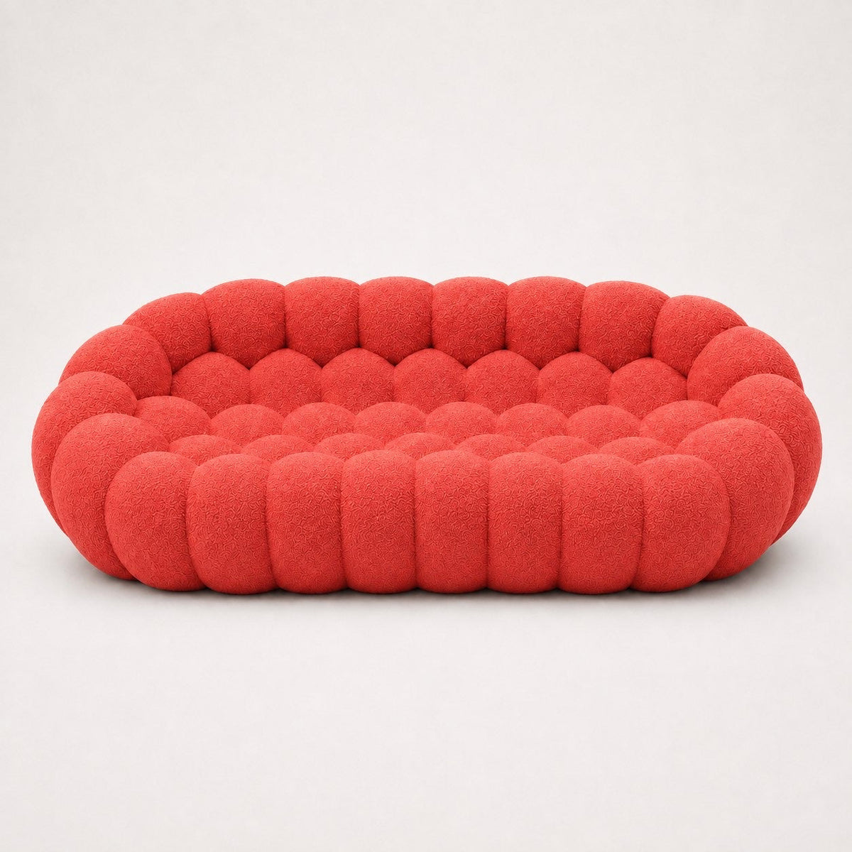 Canapé Rousseau 3-4 places en maille bouclette Rouge corail, vu de face sur fond studio — Orbe Paris