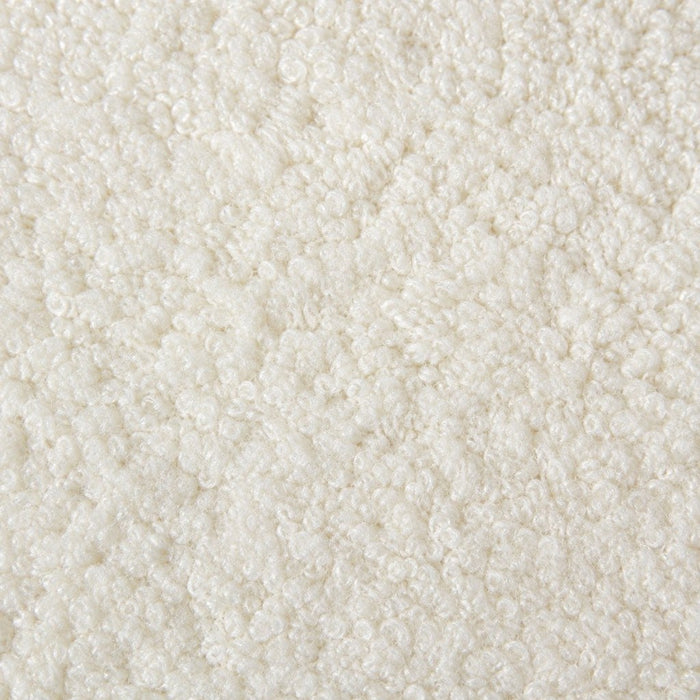 Gros plan de la maille bouclette Orbe Paris, coloris Blanc cassé.