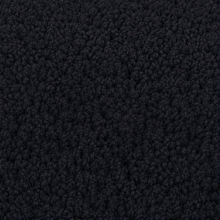 Gros plan de la maille bouclette Orbe Paris, coloris Noir.