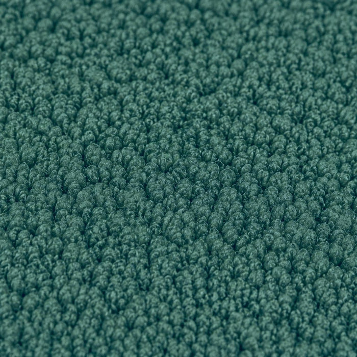 Gros plan de la maille bouclette Orbe Paris, coloris Vert canard.